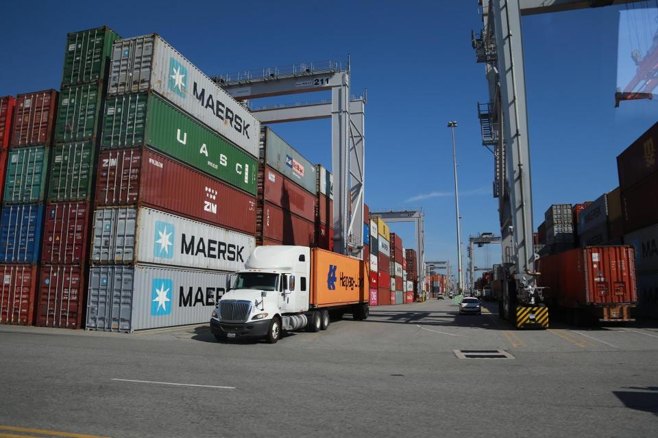 A truck drives away after having a container loaded at the  Georgia Ports Authority Garden City Terminal.