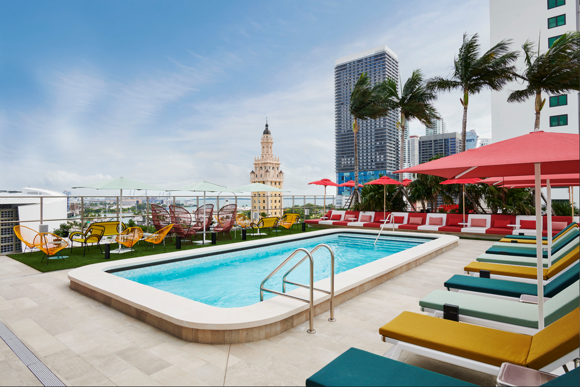 This is the citizenM Miami Worldcenter rooftop pool and deck, overlooking the Freedom Tower, a national historic landmark.