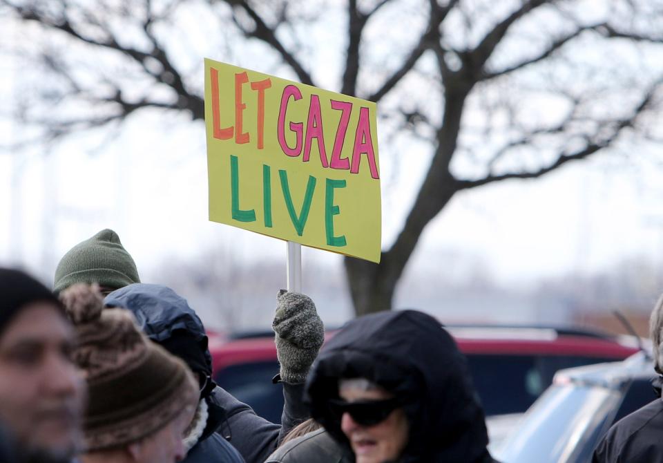 A rally of Mennonites on March 27, 2024, outside the Mishawaka office of Rep. Rudy Yakym, R-Ind., calls on the congressman to work for a cease-fire in Gaza.