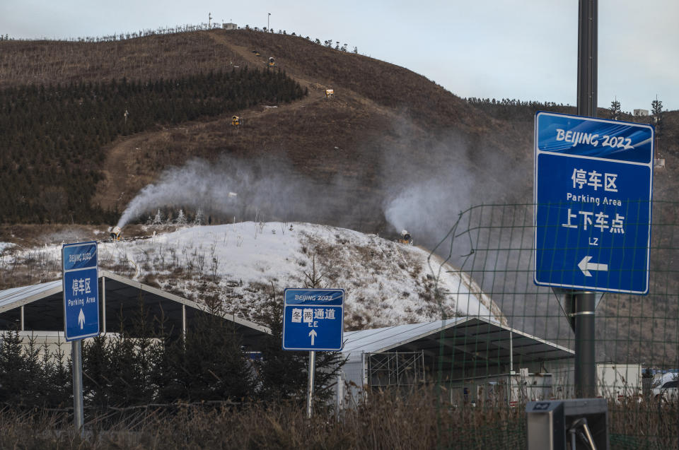 ZHANGJIAKOU, CHINA - JANUARY 02: Snow machines make artificial snow near the ski jumping venue for the Beijing 2022 Winter Olympics before the area closed to visitors, on January 2, 2022 in Chongli county, Zhangjiakou, Hebei province, northern China. The area, which will host ski and snowboard events during the Winter Olympics and Paralympics was closed off to all tourists and visitors as of January 4, 2022 and will be part of the bubble due to the global coronavirus pandemic for athletes, journalists and officials taking part in the games. The Beijing 2022 Winter Olympics are set to open February 4th. (Photo by Kevin Frayer/Getty Images)