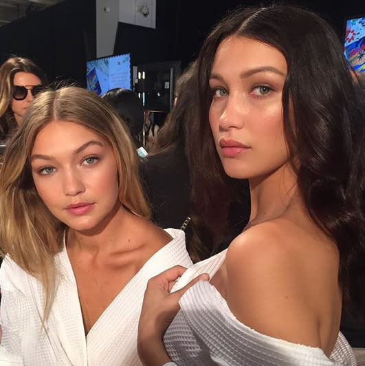 Backstage at the Tommy Hilfiger show, sisters Bella and Gigi Hadid proved that they look stunning in plain old robes. [Photo: Instagram/Bella Hadid]