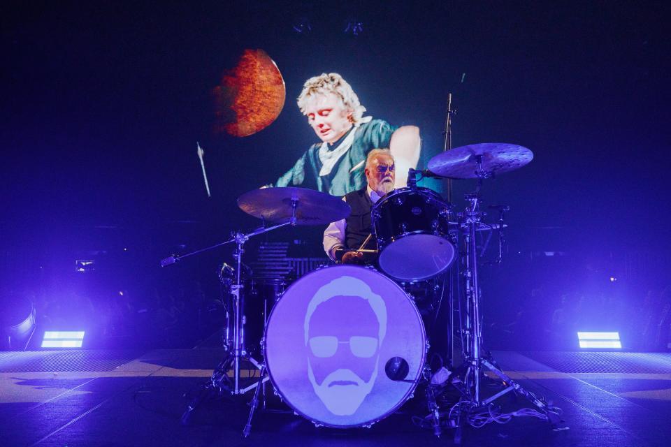 Queen drummer Roger Taylor plays a solo while his younger self looks on during the opening night of Queen's Rhapsody tour Oct. 4, 2023, in Baltimore.
