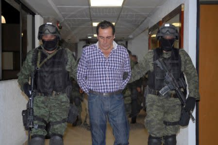 FILE PHOTO - Soldiers escort head of the Beltran Leyva drug cartel Hector Beltran Leyva in Mexico City, in this handout picture taken October 1, 2014 and released to Reuters on October 2, 2014 by the Attorney General's Office. REUTERS/Attorney General's Office/Handout via Reuters/File Photo