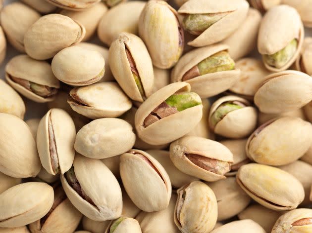 "The act of shelling pistachios can help instill mindfulness in our eating,” registered dietitian <a href="https://www.diabeteseveryday.com/" rel="nofollow noopener" target="_blank" data-ylk="slk:Toby Smithson;elm:context_link;itc:0;sec:content-canvas" class="link ">Toby Smithson</a> says. <span class="copyright">ALEAIMAGE via Getty Images</span>