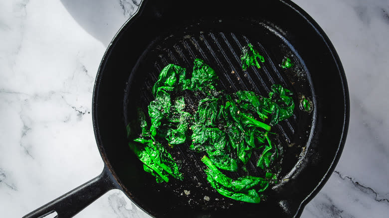 Wilted spinach in cast iron pan