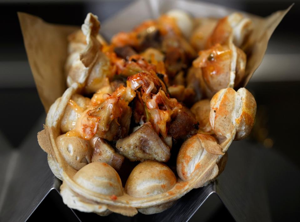 A Korean barbecue chicken "puffle" is among the new food offerings available to supporters at Lower.com Field for the 2024 season. A puffle is similar to a waffle made out of puffs of batter.