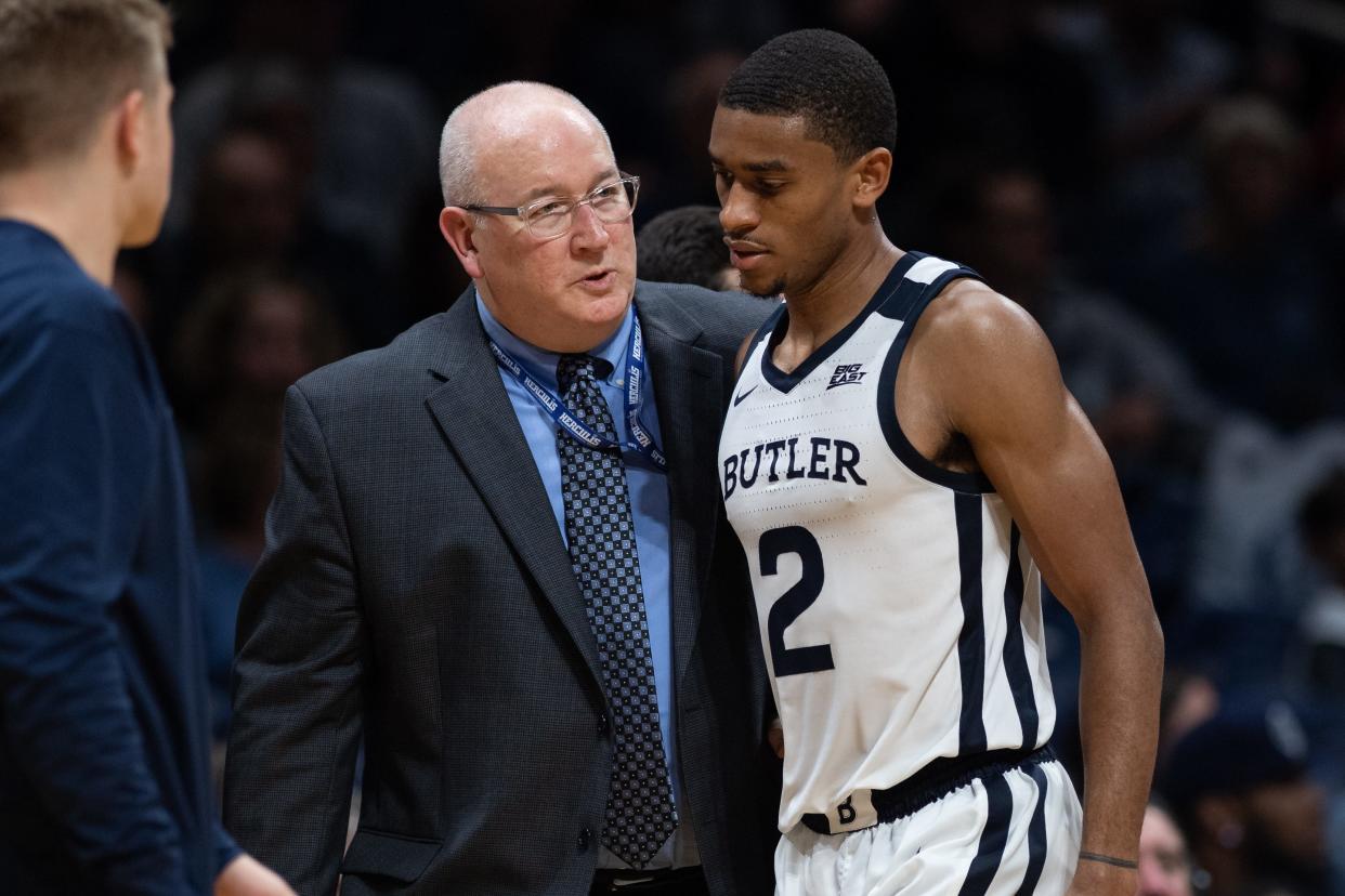 Ralph Reiff (left) talks with Aaron Thompson as the Butler guard heads to the bench on Oct. 26, 2019.