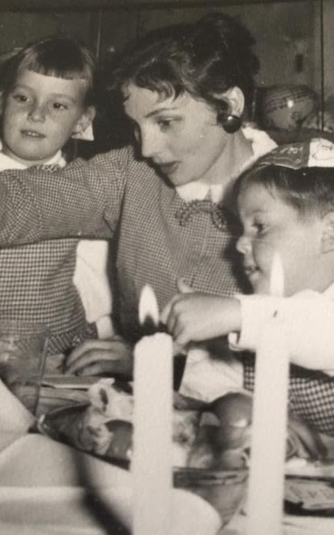 Ruth lighting Sabbath candles with Camilla's stepmother Bernice Tominey (left) and Bernice's brother Martin (right) - Credit: TMG