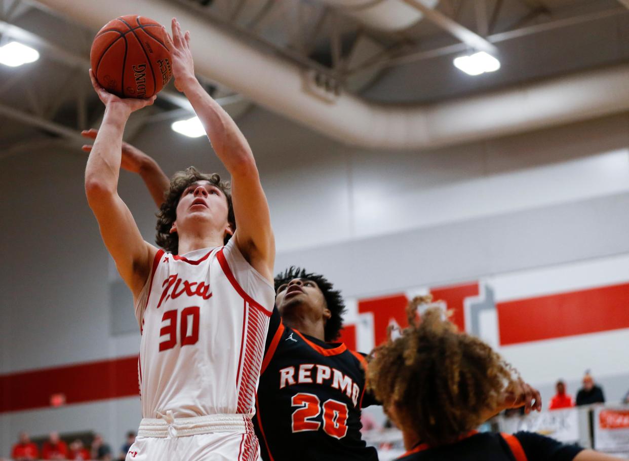 Nixa's Josh Peters tosses up a field goal as the Eagles take on the Republic Tigers during a game on Tuesday, Feb. 7, 2023. 