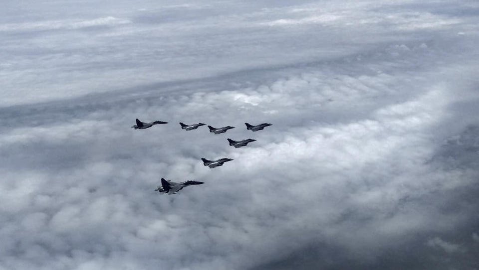 This photograph shared by Indian Defence Minister Rajnath Singh in Twitter shows Rafale fighter jets escorted by Indian Air Force Sukhoi Su-30 MKI fighter jets as they enter the Indian airspace Wednesday, July 29, 2020. A first batch of five French-made Rafale fighter jets arrived at an Indian air force base on Wednesday, Indian officials said.(Twitter via AP)