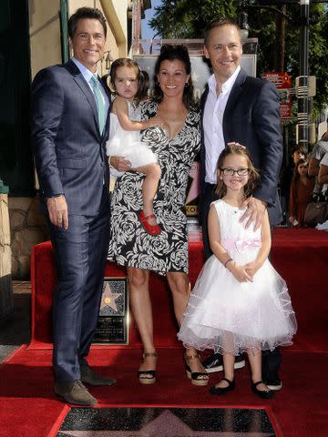 <p>Michael Germana/Everett Collection/Alamy</p> Rob Lowe, Fiona Hepler Lowe, Kim Painter, Mabel Painter Lowe, and Chad Lowe at the induction ceremony for Rob Lowe's Star on the Hollywood Walk of Fame in 2015.
