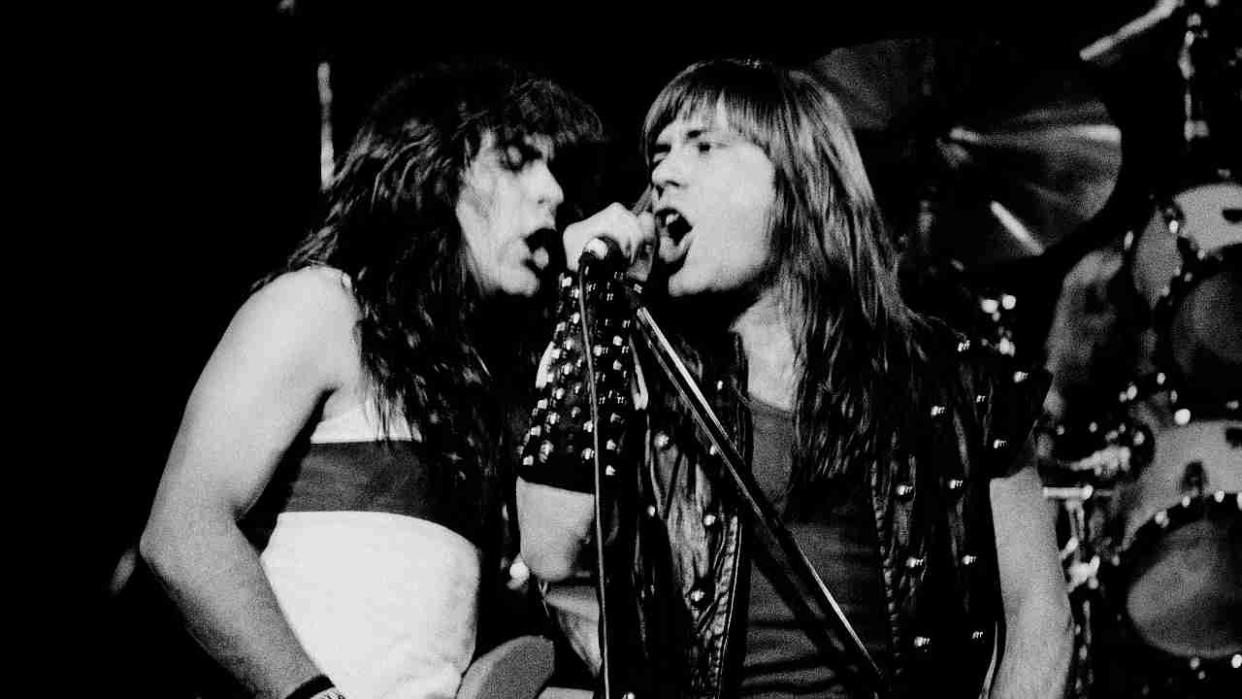  Iron Maiden’s Steve Harris and Bruce Dickinson onstage in 1982. 