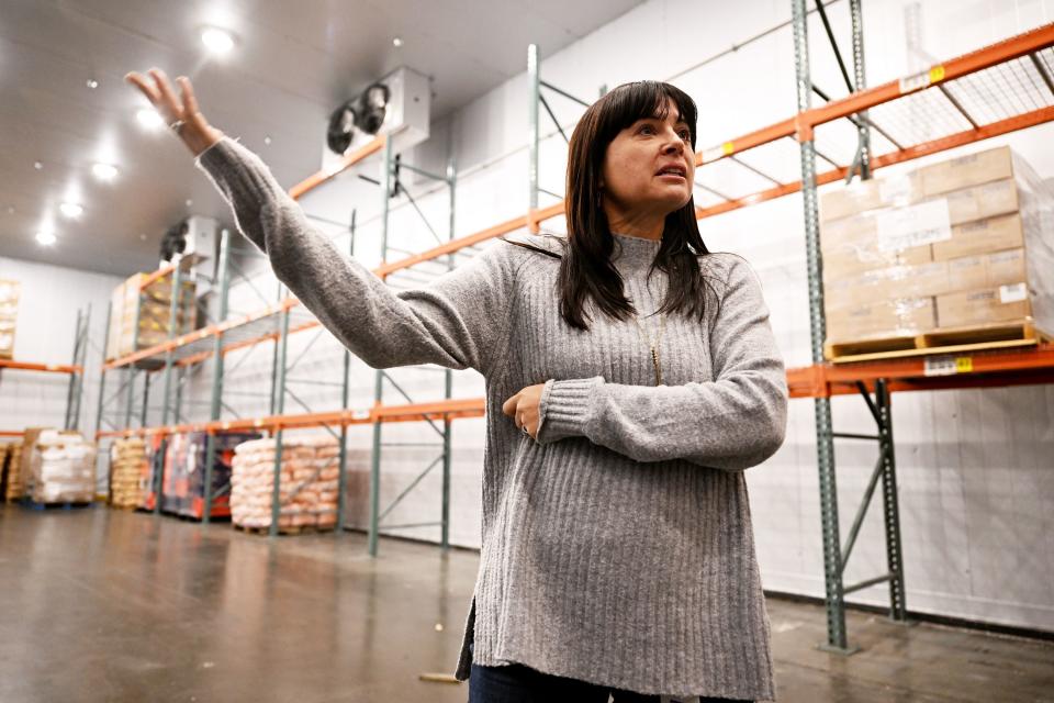 Heidi Cannella, communications director for the Utah Food Bank, talks about the product they have and the items they have for those that need it, at their South Salt Lake City warehouses on Thursday, Dec. 28, 2023. | Scott G Winterton, Deseret News