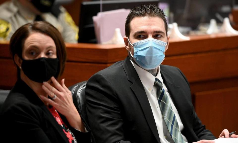 Defense attorney Molly Hastings and Kylr Yust watch as a defense witness walks into the courtroom on the ninth day of Yusts’s murder trial at the Cass County Justice Center Wednesday, April 14, 2021. Yust is charged with two counts of first-degree murder in the deaths of Kara Kopetsky, 17, and Jessica Runions, 21.