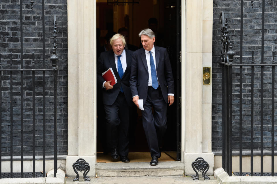 Britain's Foreign Secretary Boris Johnson (L) and Chancellor Philip Hammond leave number 10,  Downing Street. Photo by Leon Neal/Getty Images