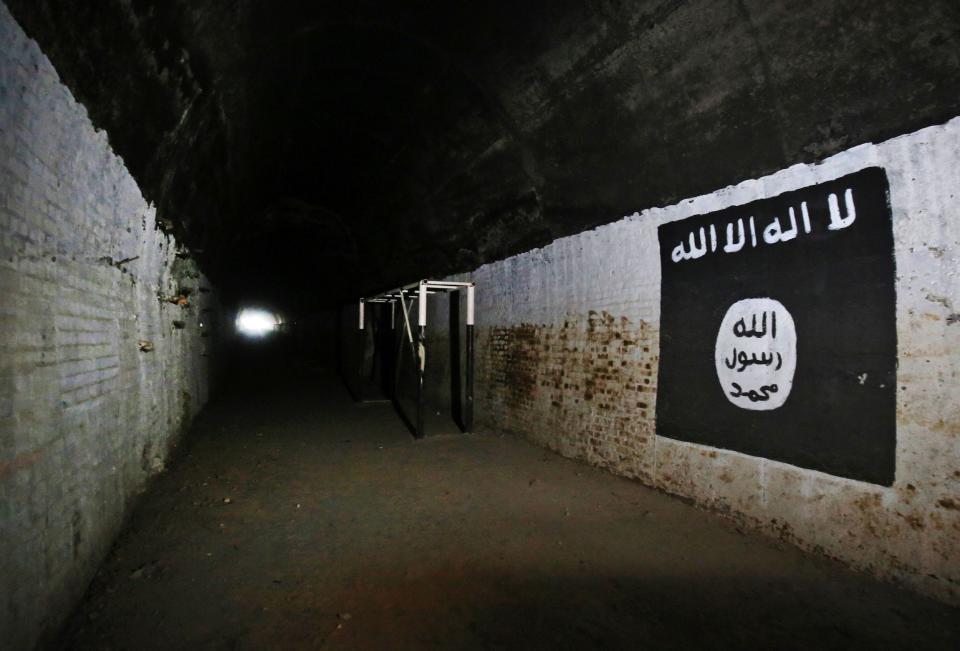 A photo of the logo of the Islamic State in a tunnel.