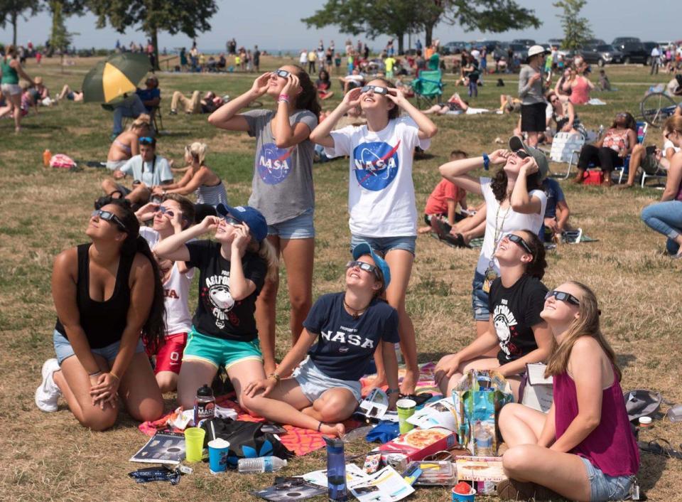 a group of people sitting on the ground