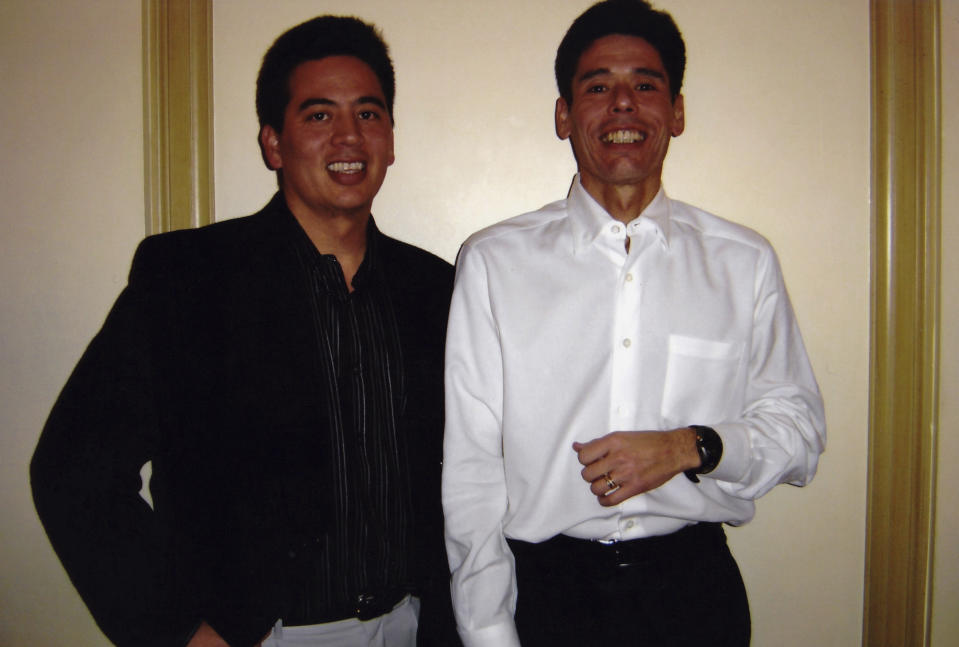 This undated photo shows from left, Craig Yabuki and his brother Jeff Yabuki. Jeff Yabuki and his wife, Gail, gave $20 million to improve mental health services for children in honor of his brother, Craig who died by suicide in 2017.(Courtesy of Jeff Yabuki via AP)