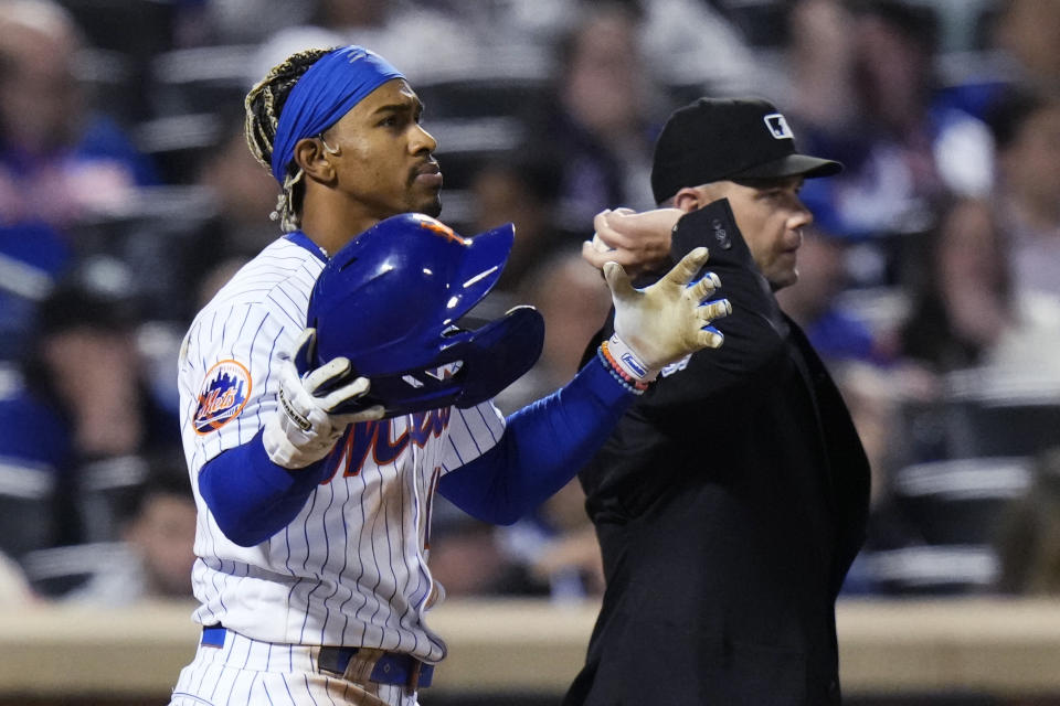 New York Mets' Francisco Lindor reacts after striking out during the eighth inning of the team's baseball game against the San Diego Padres on Tuesday, April 11, 2023, in New York. (AP Photo/Frank Franklin II)