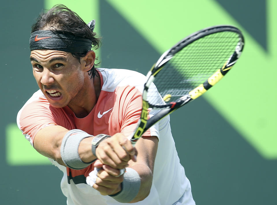 Rafael Nadal, of Spain, returns a shot from Novak Djokovic, of Serbia, during the men's final match at the Sony Open Tennis tournament on Sunday, March 30, 2014, in Key Biscayne, Fla. (AP Photo/J Pat Carter)