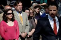 Attorney Josh Koskoff (R) speaks to media members as family members of victims of the Sandy Hook Elementary School shooting stand behind him before a hearing at the Fairfield County Courthouse in Bridgeport, Connecticut, U.S., June 20, 2016, where the maker of the gun used in the 2012 massacre of 26 young children and educators at the Connecticut elementary school will ask a judge to toss a lawsuit saying the weapon never should have been sold to a civilian. REUTERS/Mike Segar