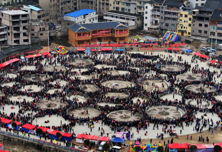 People celebrate the Reed Pipe Festival of the Miao ethnic group, in Zhouxi township, Kaili, southwest China's Guizhou province, on February 19, 2014