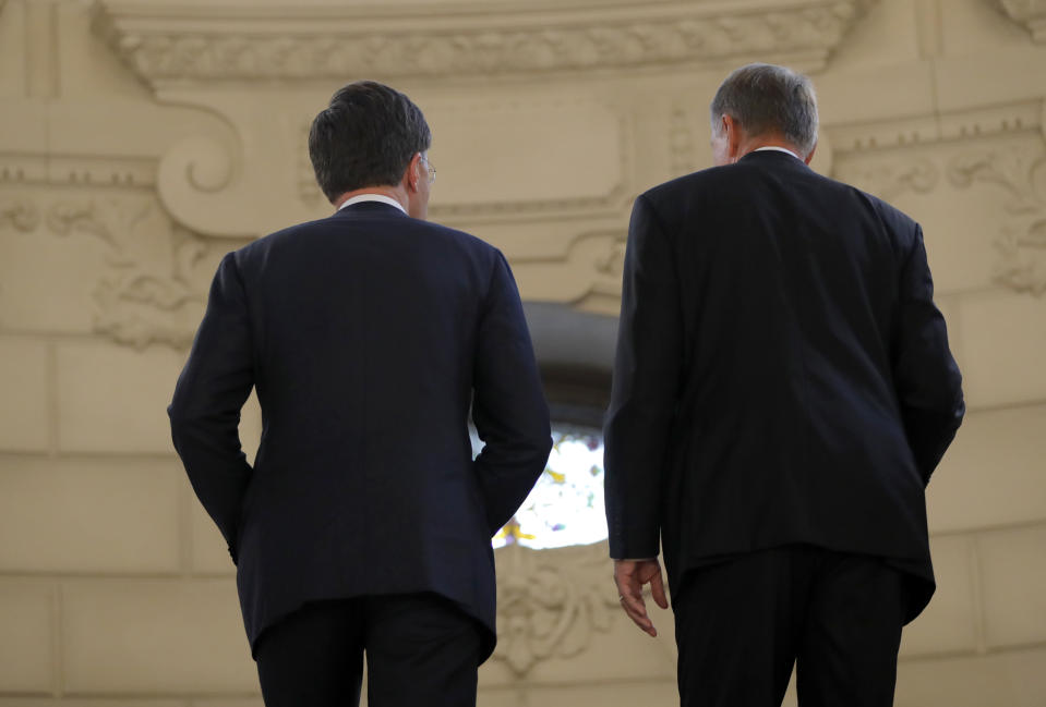 Dutch Prime Minister Mark Rutte, left, walks with Romanian President Klaus Iohannis at the Cotroceni Presidential Palace in Bucharest, Romania, Wednesday, Sept. 12, 2018. Rutte is on a one day official visit to Romania.(AP Photo/Vadim Ghirda)