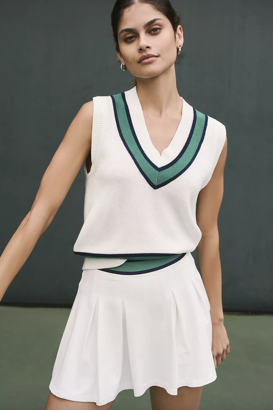 model wearing matching white and green tennis skirt and top, The Upside Topspin Lucinda Skirt (photo via Anthropologie)