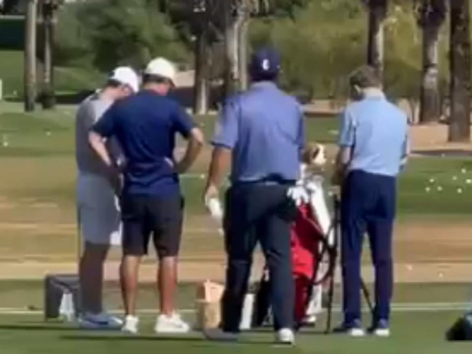 Patrick Reed approaches Rory McIlroy on the range in Dubai (Ten-Golf)