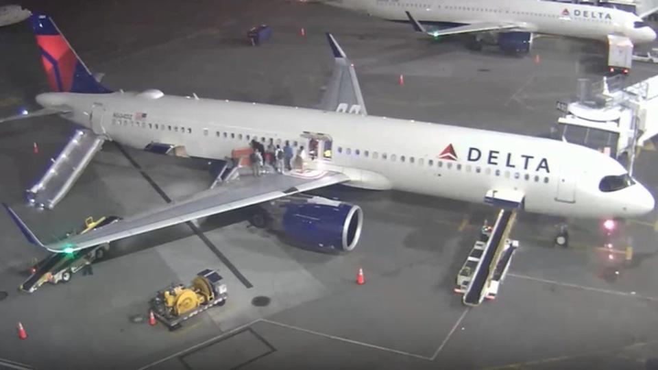 <div>Emergency crews are seen surrounding the plane on Monday, May 6 in Seattle.</div> <strong>(Port of Seattle/SEA Airport)</strong>