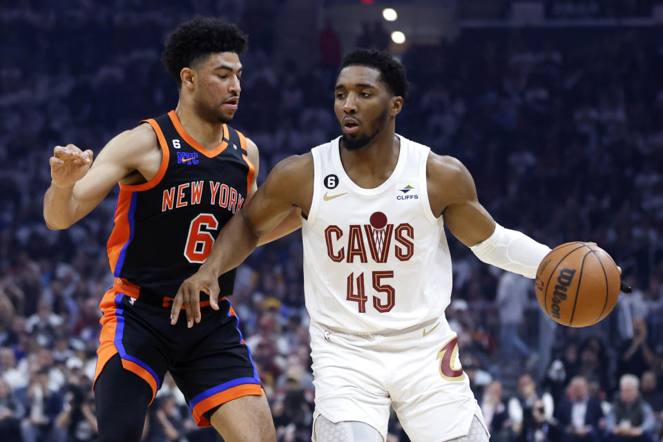 Cleveland Cavaliers guard Donovan Mitchell (45) drives against New York Knicks guard Quentin Grimes (6) during the first half of Game 2 of an NBA basketball first-round playoff series Tuesday, April 18, 2023, in Cleveland. (AP Photo/Ron Schwane)