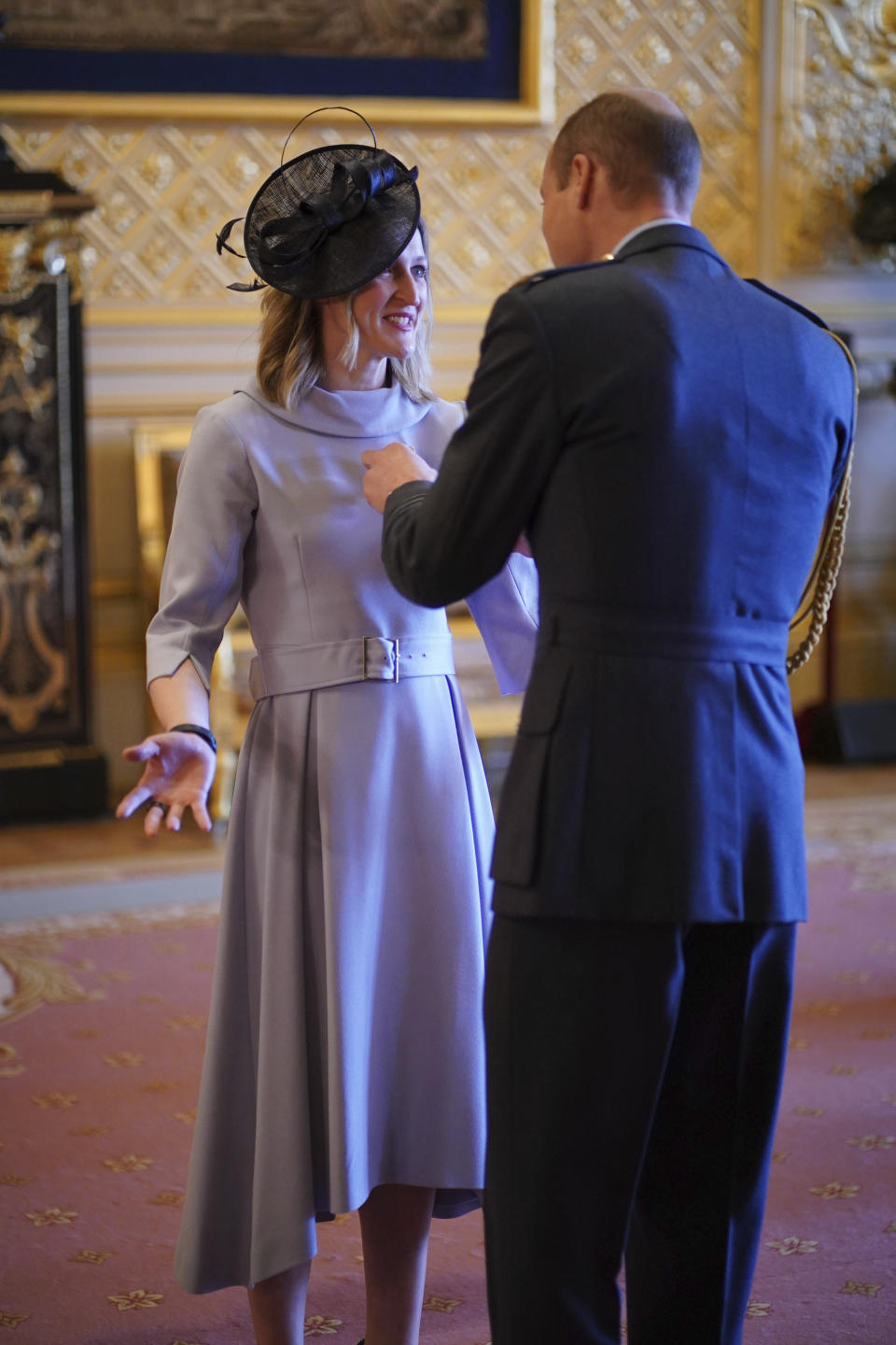 Britain's Prince William, the Prince of Wales, right, awards Mrs Ellen Convery (Ellen White), former soccer player, with the Commander of the Order of the British Empire, at Windsor Castle, Windsor, England, Wednesday, Feb. 7, 2024. (Yui Mok/PA via AP)