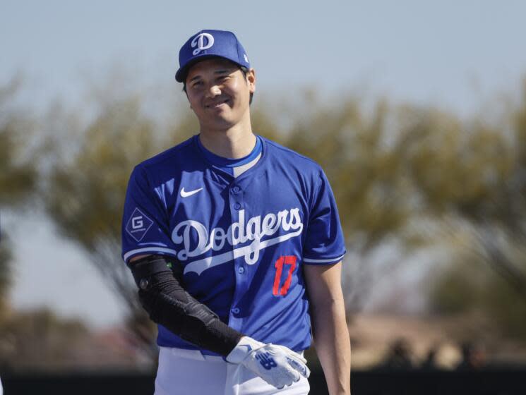 Goodyear, Arizona, Wednesday, February 14, 2024 - Shohei Ohtani warms up near the batting cage.