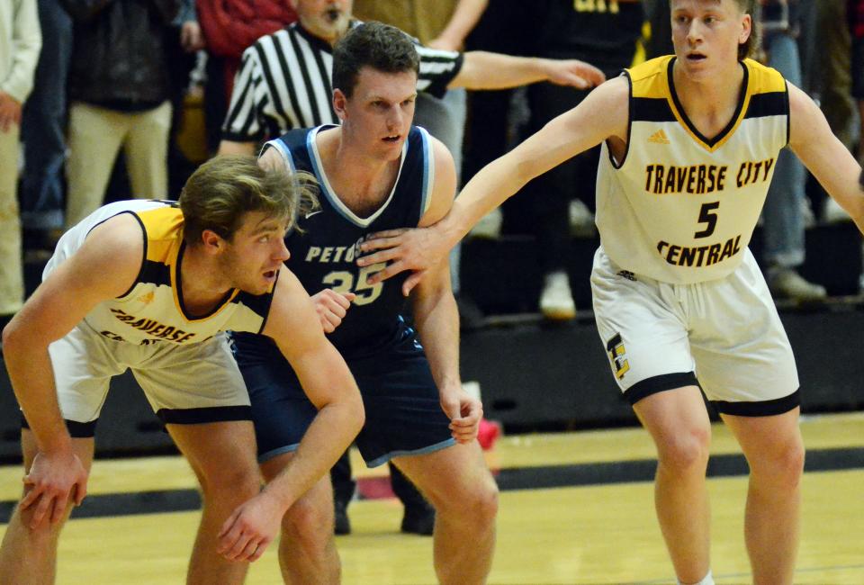 Petoskey's Jackson Jonker (middle) closed up a strong career as a tough defender and sneaky 3-point shooter for the Northmen.