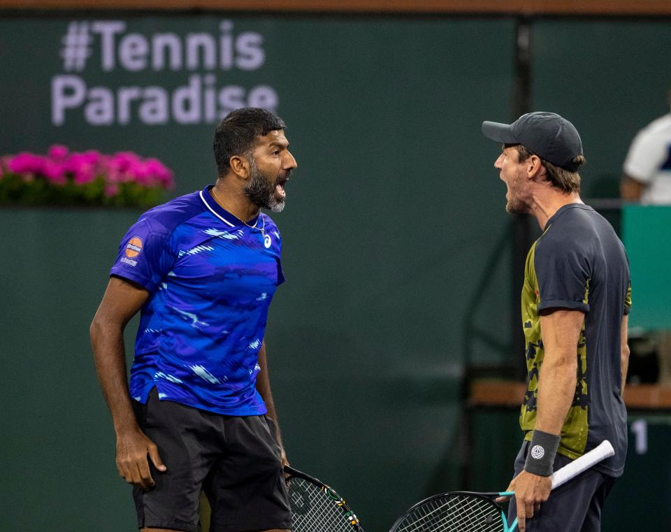 Rohan Bopanna of India (left) celebrates with teammate Matthew Ebden of Australia after beating Wesley Koolhof of the Netherlands and Neal Skupski of Great Britain in the men's doubles final at the BNP Paribas Open at the Indian Wells Tennis Garden in Indian Wells, Calif., Saturday, March 18, 2023. 