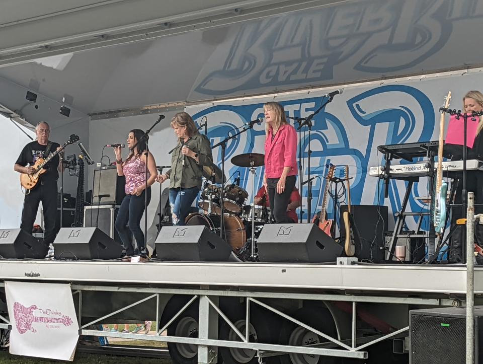 The Pink Paisleys band performs before the award ceremony at the Jacksonville Fairgrounds for the Gate River Run on March 5, 2022. [Clayton Freeman/Florida Times-Union]