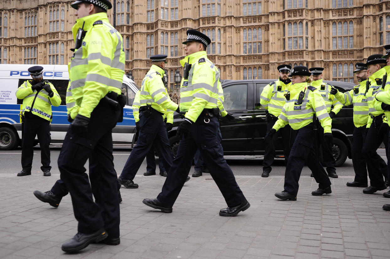 Police officers approach Brexit supporters and opponents demonstrating opposite the Houses of Parliament in London, England, on January 29, 2019. In the Commons, on a day of significant parliamentary activity over Brexit, MPs voted down a cross-party amendment tabled by Labour Party MP Yvette Cooper and Conservative Party MP Nick Boles designed to substantially reduce the risk of a much-feared 'no-deal' exit from the EU. An amendment rejecting the principle of a no-deal exit was meanwhile approved, as was a government-backed amendment championed by Conservative Party MP Graham Brady calling for 'alternative arrangements' to take the place of the controversial Irish 'backstop' provision in the withdrawal agreement negotiated with the EU. (Photo by David Cliff/NurPhoto via Getty Images)