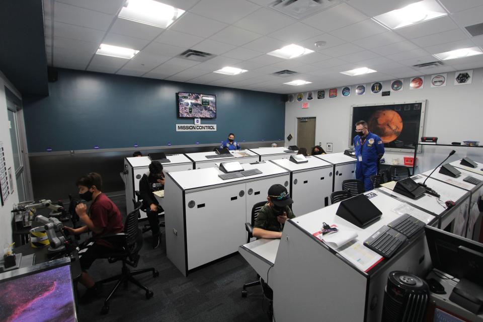 Sierra Middle School sixth-graders work at their assigned roles in the simulated Mission Control at the Las Cruces Challenger Learning Center on Thursday, Sept. 9, 2021.