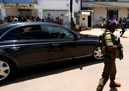 Cameroonian President Paul Biya waves as he leaves the polling station after casting his ballot for the presidential election in Yaounde, Cameroon October 7, 2018. REUTERS/Zohra Bensemra