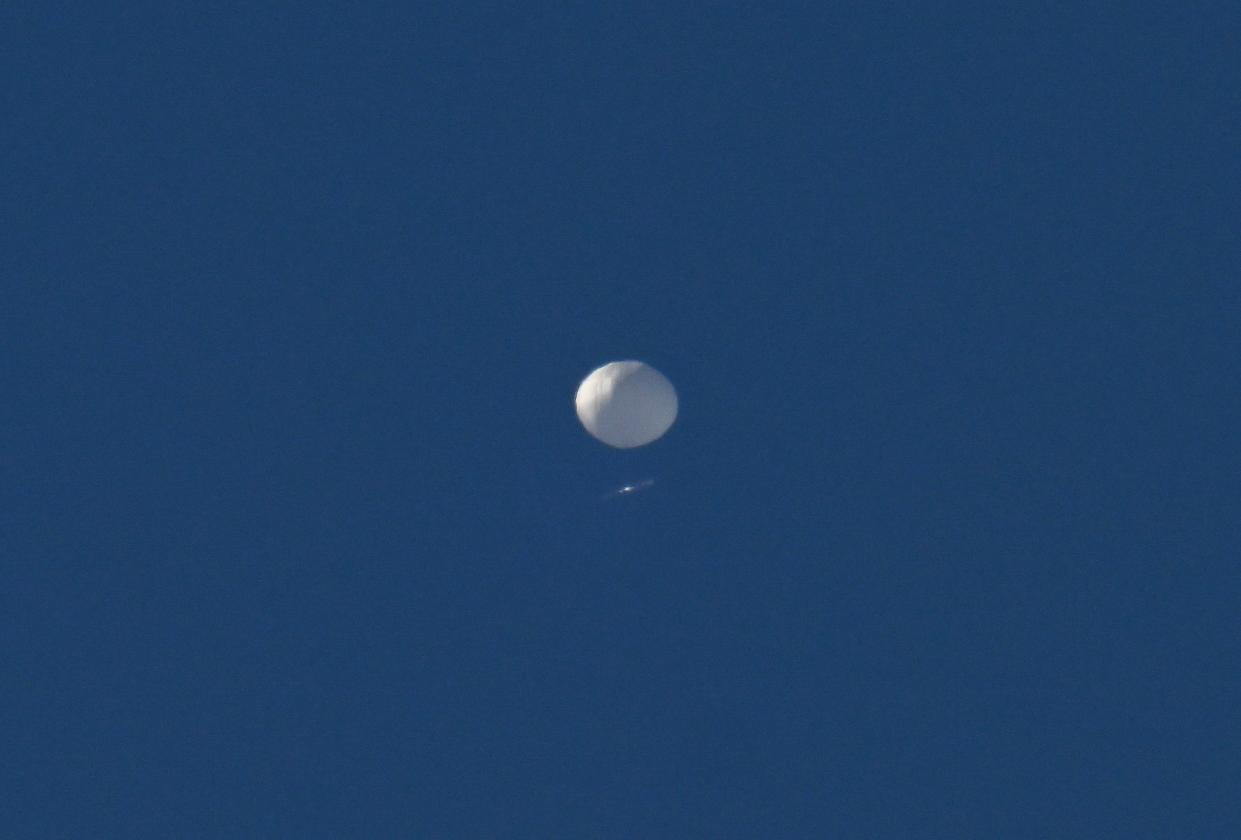 A Chineses surveillance balloon flies above in Charlotte, North Carolina, on February 4, 2023.