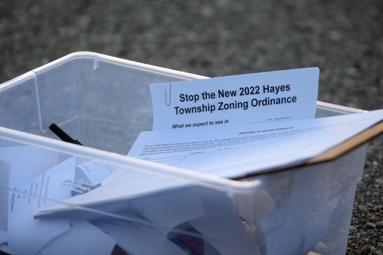A heading reads "Stop the new 2022 Hayes Township Zoning Ordinance," on an informational packet about the rezoning of Hayes Township.
