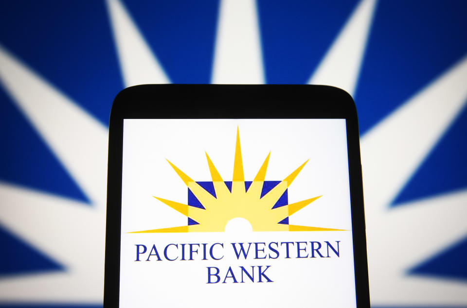 UKRAINE - 2021/07/13: In this photo illustration, Pacific Western Bank logo is seen on a smartphone screen with a part of  PacWest Bancorp logo in the background. (Photo Illustration by Pavlo Gonchar/SOPA Images/LightRocket via Getty Images)