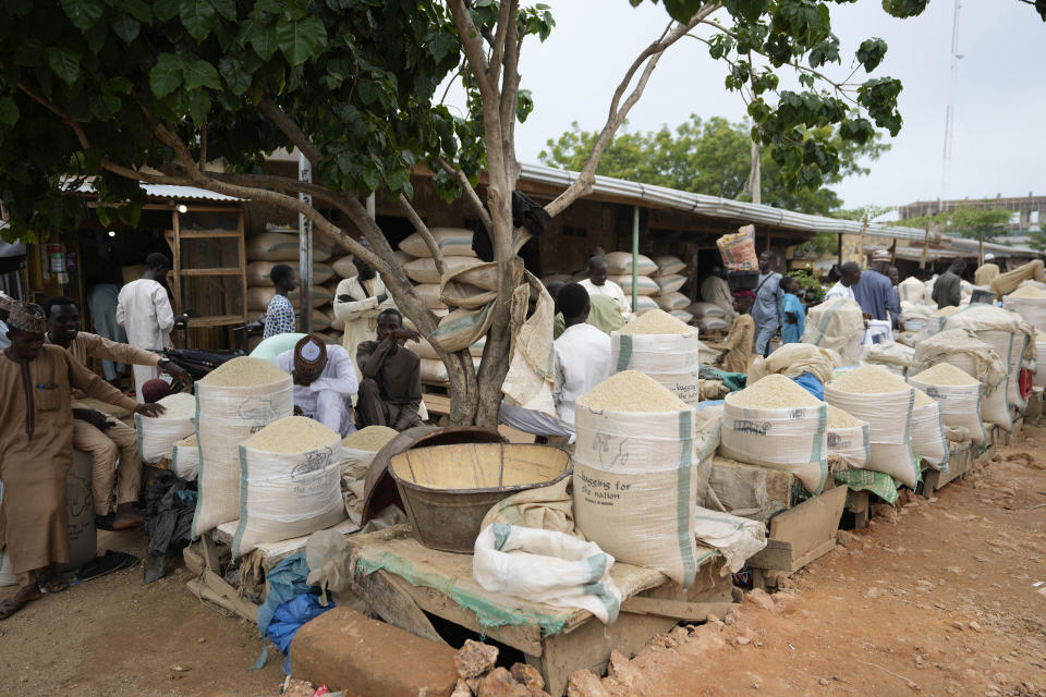 People sells rice in Dawanau International Market in Kano Nigeria, Friday, July 14, 2023. Nigeria introduced programs before and during Russia's war in Ukraine to make Africa's largest economy self-reliant in wheat production. But climate fallout and insecurity in the northern part of the country where grains are largely grown has hindered the effort. (AP Photo/Sunday Alamba)