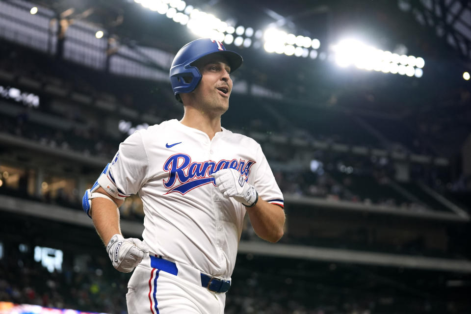 Texas Rangers' Nathaniel Lowe jogs to the dugout after hitting a solo home run in the first inning of a baseball game against the Seattle Mariners in Arlington, Texas, Thursday, April 25, 2024. (AP Photo/Tony Gutierrez)