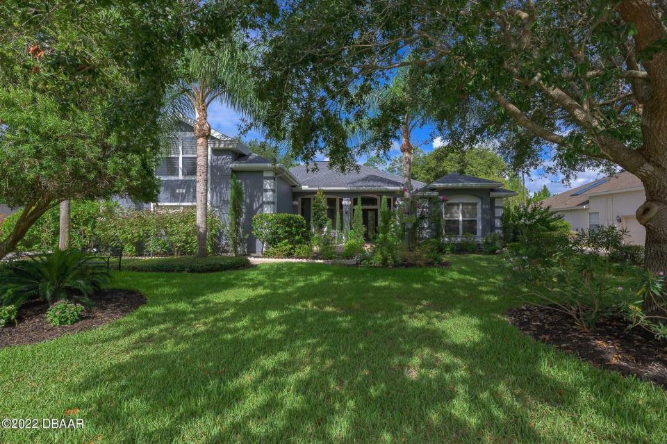 This spacious custom-built family home is in the desirable Ormond Beach community of Breakaway Trails.