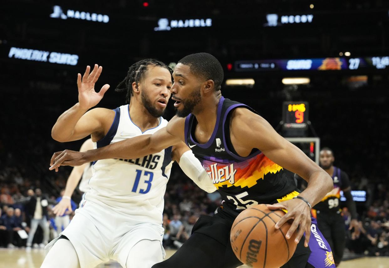 May 15, 2022; Phoenix, Arizona, USA; Dallas Mavericks guard Jalen Brunson (13) pressures Phoenix Suns forward Mikal Bridges (25) during game seven of the second round for the 2022 NBA playoffs at Footprint Center.