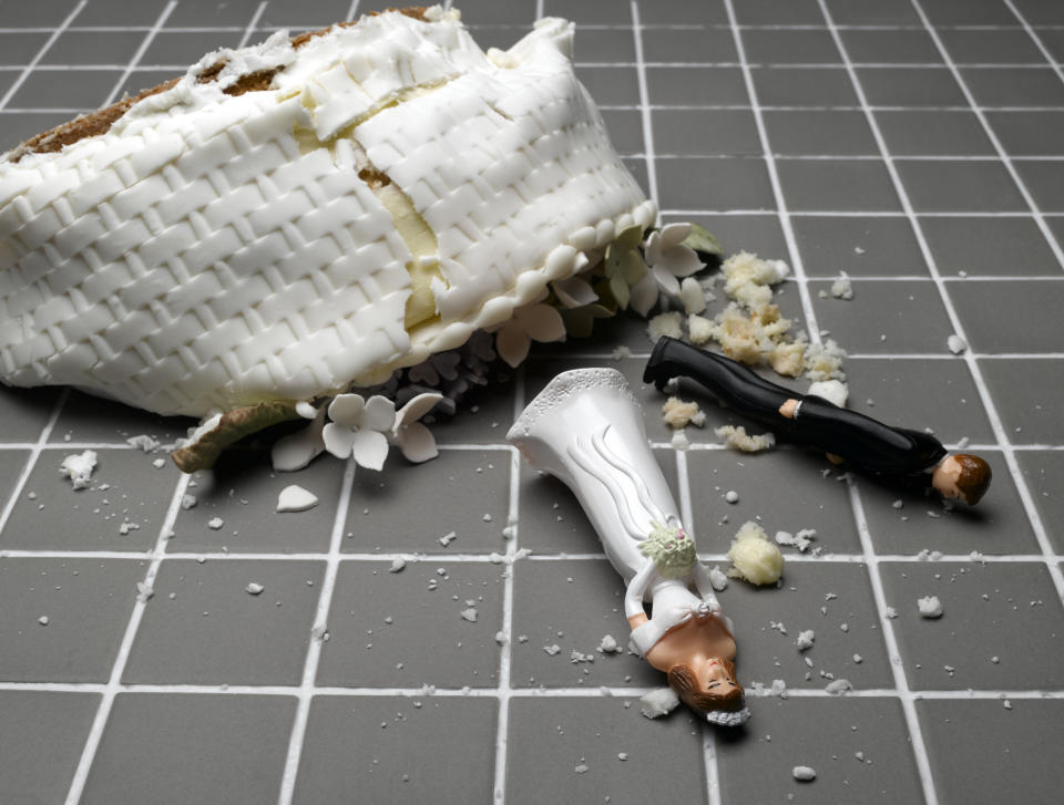 bride groom figurines destroyed wedding cake 