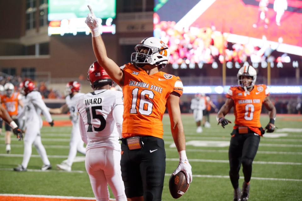 Oct 28, 2023; Stillwater, Oklahoma, USA; Oklahoma State Cowboys tight end Josiah Johnson (16) celebrates after scoring a touchdown during a college football game between Oklahoma State and Cincinnati at Boone Pickens Stadium. Mandatory Credit: Bryan Terry-USA TODAY Sports