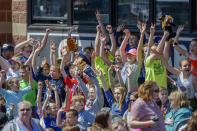 FILE - In this April 11, 2018, file photo, school children cheer as the West Virginia Power face the Lakewood BlueClaws at Appalachian Power Park, in Charleston, W.V. Major League Baseball is pushing a proposal to whack 42 teams _ and several entire leagues _ from its vast network of minor-league affiliates that bring the game to every corner of country. Take the South Atlantic League, a Class A organization that has 14 teams stretching from New Jersey to Georgia. Under the contraction plan, three of its teams _ the Hagerstown Suns, Lexington Legends, West Virginia Power _ would be eliminated. (Craig Hudson/Charleston Gazette-Mail via AP, File)