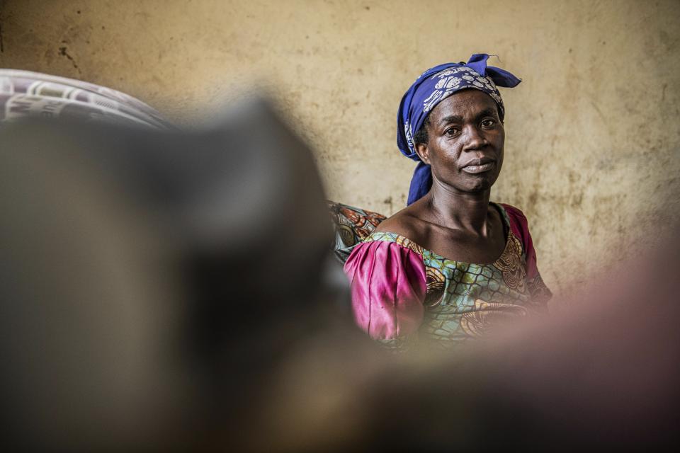 People fleeing the fighting between M23 forces and the Congolese army find refuge in a church in Kibumba, north of Goma, Democratic Republic of Congo, Friday Jan. 28, 2022. In the past week, inhabitants from six villages in the country's east – including, Bukima, Nyesisi, and Ruhanga – have fled the violence. At least 2,000 people are now living in improvised shelters, in churches, schools or with host families. (AP Photo/Moses Sawasawa)